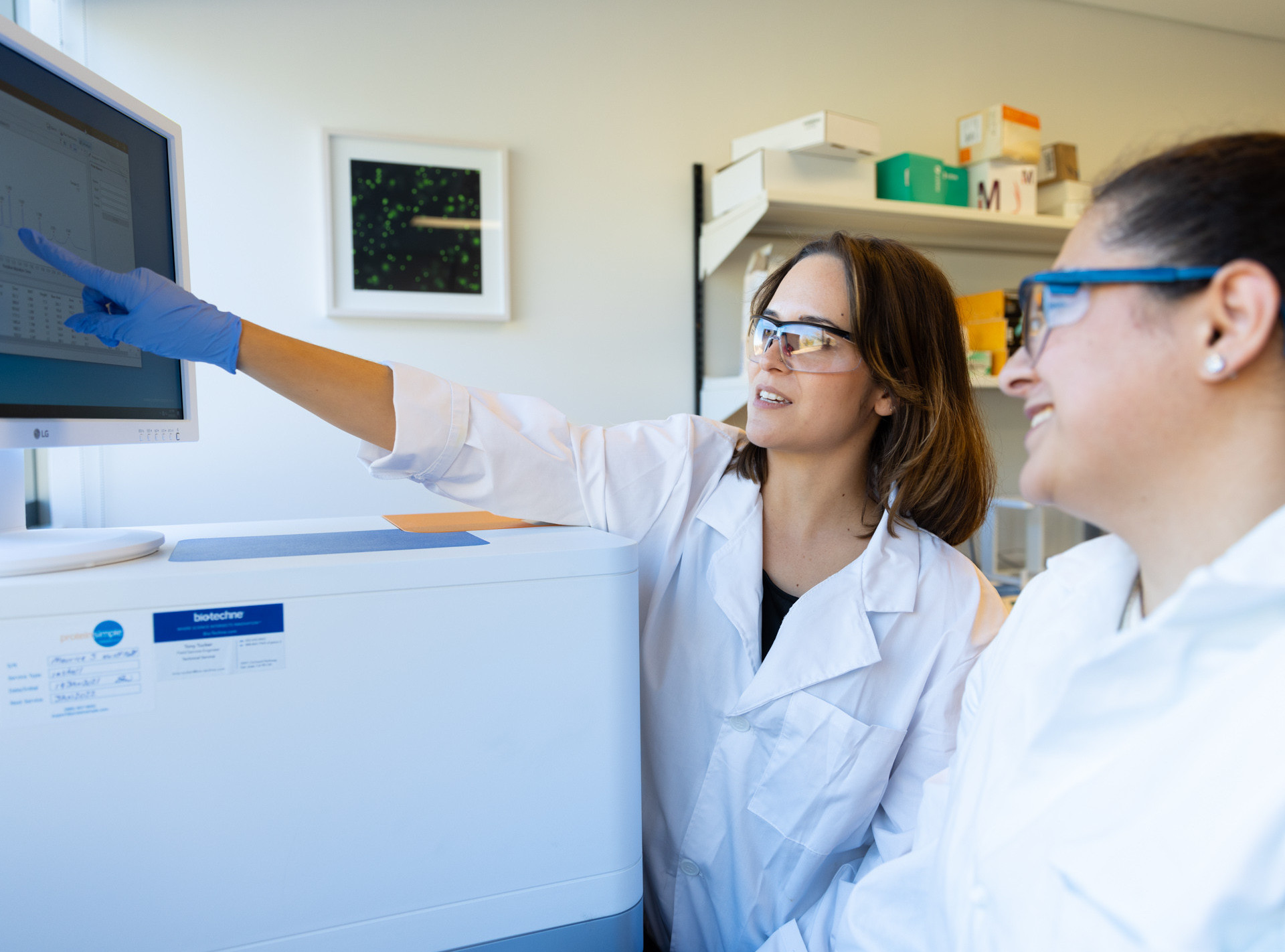 KU Innovation Park Scientists reading data on a screen